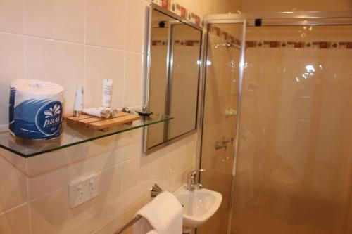 a bathroom with a shower and a sink at Leura Fairways East in Leura