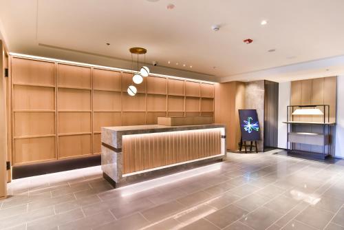 a lobby with a hair salon with a cash register at Four Points by Sheraton Taipei Bali in Bali