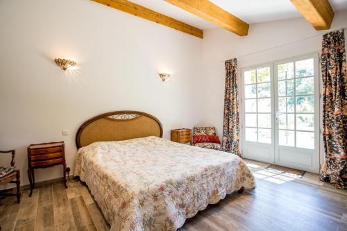 Ein Bett oder Betten in einem Zimmer der Unterkunft Domaine L'Helion
