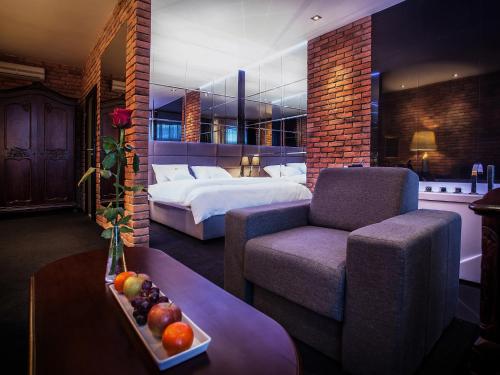Posteľ alebo postele v izbe v ubytovaní Hotel Betmanowska Main Square Residence Adults Only