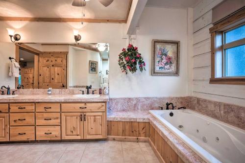 a large bathroom with a tub and a sink at Brookings Vacation Rental Lodge on 88 Acres! in Brookings