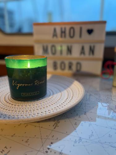 a green candle sitting on top of a map at Süsses Motorboot - Bremen Überseestadt in Bremen