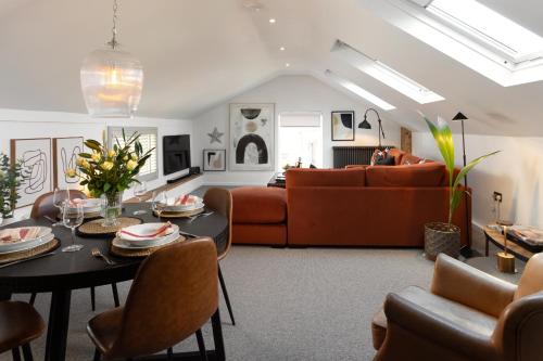 a living room with a table and a couch at The Workshop in York