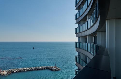 a view of the ocean from a building at Signiel Busan in Busan