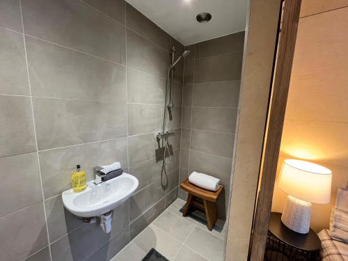 a bathroom with a sink and a shower at The Dell at Glenlivet in Glenlivet