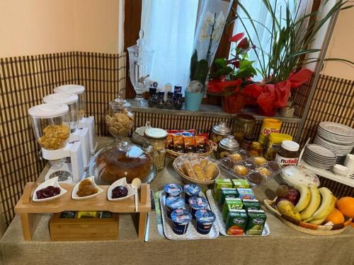 a table filled with food and other food items at Casa Ai Cappuccini in Randazzo
