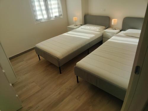 Кровать или кровати в номере APPARTAMENTO MARIELLA - CITRA 011022-LT-166