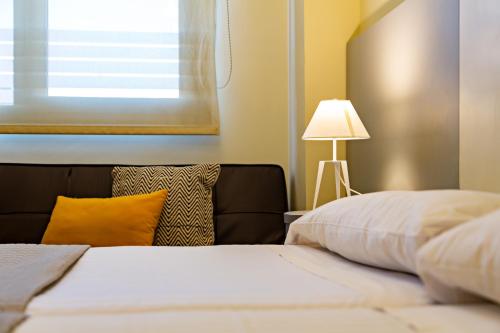 Cama o camas de una habitación en OK Hoteles Estudios Plata