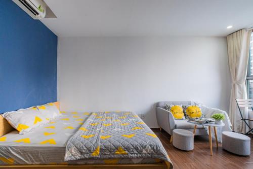 a bedroom with a bed and a chair at Orchard Garden -Near TSN Airport 5 minutes -Nice in Ho Chi Minh City