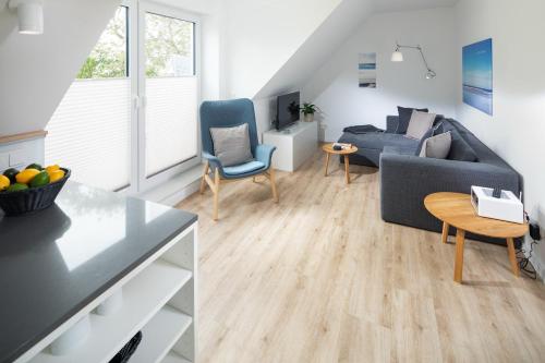 a living room with a couch and a table at Steg N 5 in Norderney