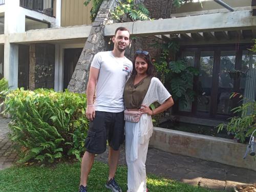 a man and a woman standing in front of a building at Villa Tulip Garden in Anuradhapura