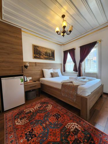 Кровать или кровати в номере Kadıköy White House