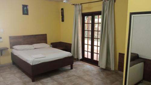 Ліжко або ліжка в номері Casa do Murebe