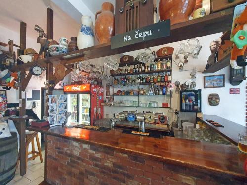 a bar in a restaurant with a counter top at Hrusická restaurace a penzion in Hrusice