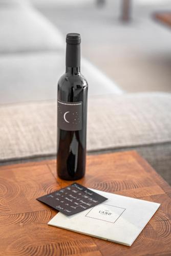 a bottle of wine sitting on top of a table at L'AND Vineyards - Relais & Châteaux in Montemor-o-Novo