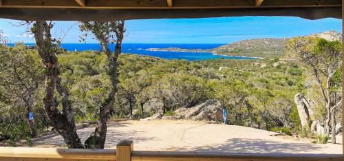 a view of the ocean from a house at Camping Kévano Plage in Pianottoli-Caldarello