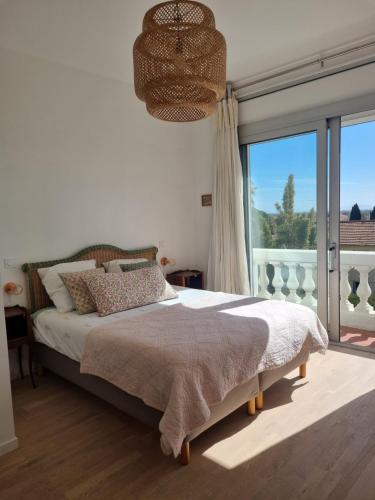 Ένα ή περισσότερα κρεβάτια σε δωμάτιο στο Villa Marguerite