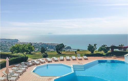 a swimming pool with lounge chairs and a swimming pool at Casa Nardi in Parghelia