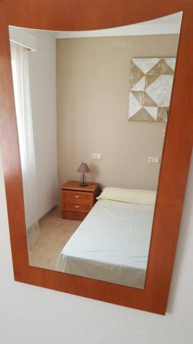 Postel nebo postele na pokoji v ubytování ENCANTO Y COMODIDAD EN PLENO CENTRO DE RONDA