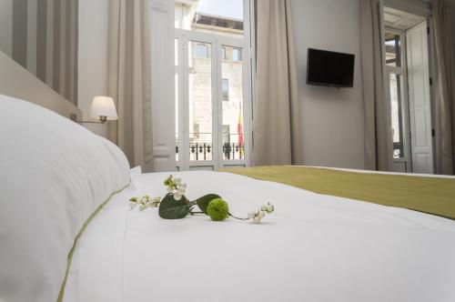 Postel nebo postele na pokoji v ubytování Hotel San Lorenzo Boutique