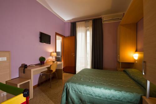 Postel nebo postele na pokoji v ubytování Hotel Mary Fleur