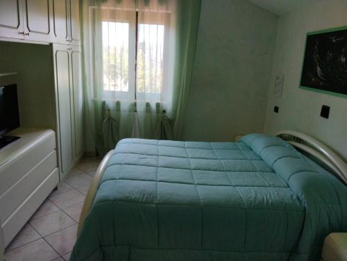 Postel nebo postele na pokoji v ubytování B&B Angolo Verde