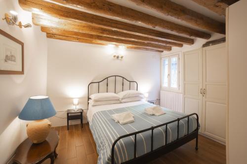 Postel nebo postele na pokoji v ubytování Cà Gamba by Venicevillas, Guglie