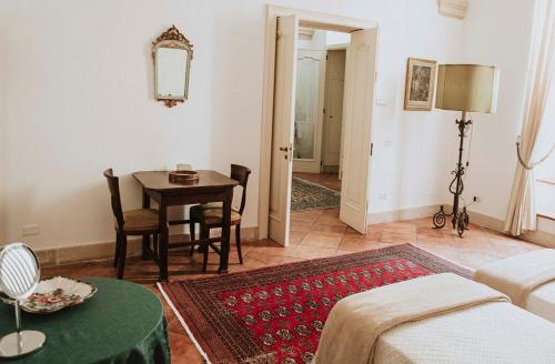 a living room with a table and a couch at Dimora Santangelo in Lecce