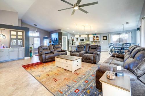 a large living room with couches and a table at Spacious Arizona Getaway with Pool, Pets Welcome! in Surprise