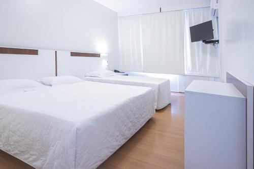 Katil atau katil-katil dalam bilik di Hotel Gracher Brusque