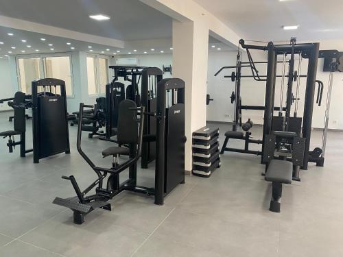a gym with several tread machines in a room at Studio Très Moderne Gallo 1 - Mamelles Dakar in Dakar