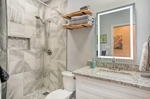 a bathroom with a shower and a toilet and a sink at Texoma Lakefront in Tanglewood Golf Resort! in Pottsboro