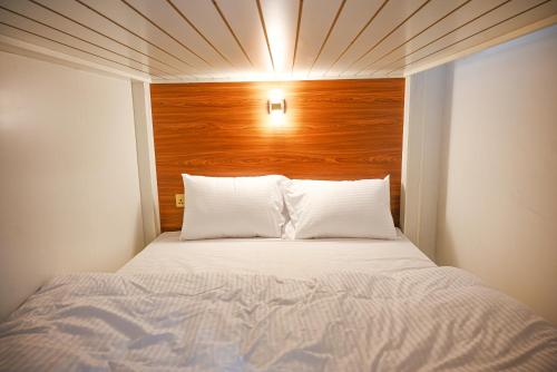 Cama o camas de una habitación en Goodliving vacation homes
