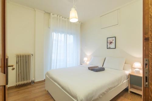 Postel nebo postele na pokoji v ubytování Houseloft Ideal Kalamaria