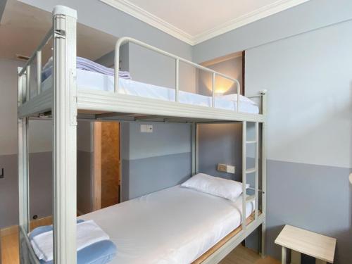 Postel nebo postele na pokoji v ubytování K Hotel 1515