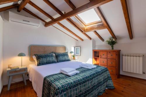 Postel nebo postele na pokoji v ubytování Casa Pequena by LovelyStay