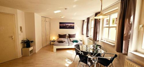 Ένα ή περισσότερα κρεβάτια σε δωμάτιο στο Apartments Pfannenstübchen