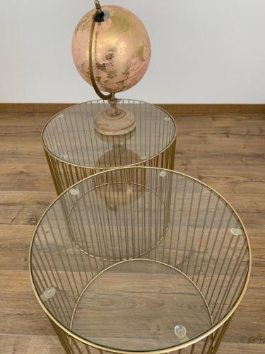 a glass table with a globe on top of it at APPARTEMENT OR in Manosque