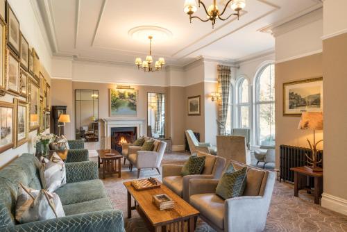 a living room with couches and a fireplace at The Borrowdale Hotel in Keswick