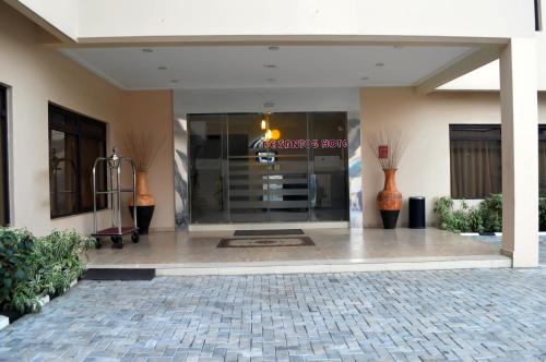 a lobby of a building with a sign on it at De Santos Hotel in Agege