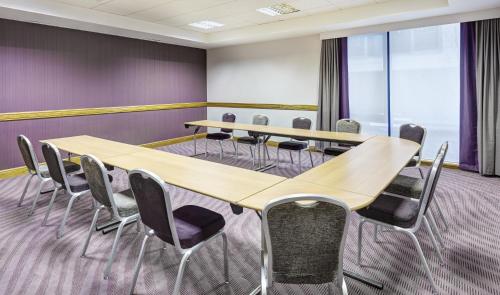 a conference room with a table and chairs at Leonardo Hotel Milton Keynes in Milton Keynes
