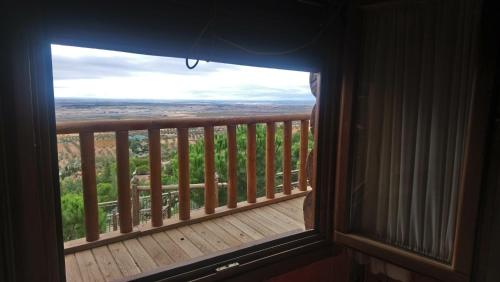 a window in a room with a view of a deck at El Mirador de la Mancha in Villarrubia de los Ojos
