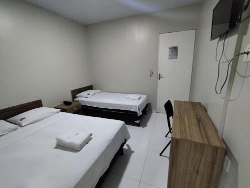 Postel nebo postele na pokoji v ubytování Hotel Resende