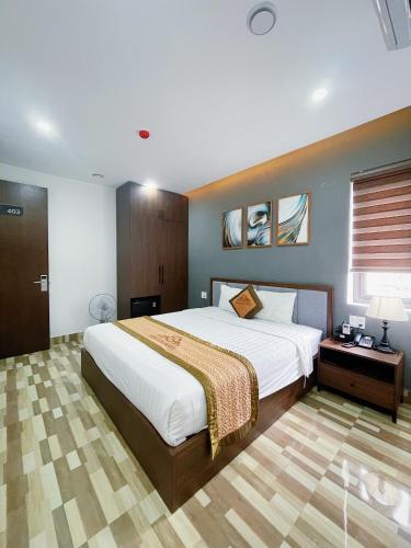 Postel nebo postele na pokoji v ubytování Minh Anh Hotel & Apartment