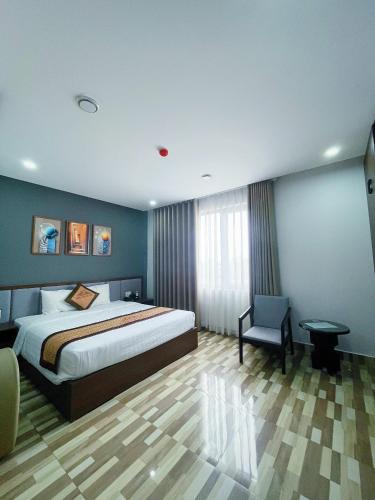 Postel nebo postele na pokoji v ubytování Minh Anh Hotel & Apartment