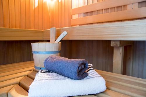 a towel sitting on a table in a sauna at Apartmenthaus Frauenpreis FeWo 61 in Cuxhaven
