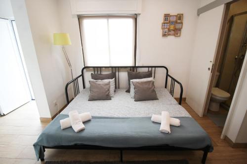 Postel nebo postele na pokoji v ubytování Oriente DNA Studios IV