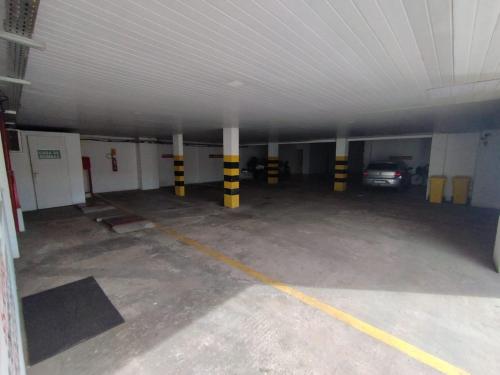 a large parking garage with a car parked in it at Hotel Resende in Imperatriz