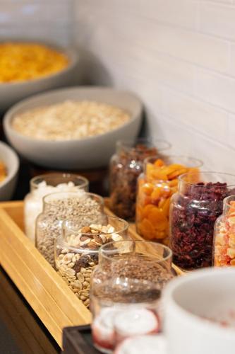 a wooden tray filled with different types of food at Quality Hotel Augustin in Trondheim