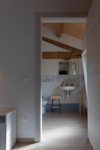 a bathroom with a sink and a toilet in a room at B&B La Casa Gialla in Ravenna